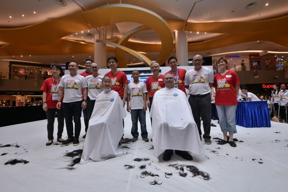 Hair for Hope 2017 ceremonial shavees and ceremonial shavers on stage